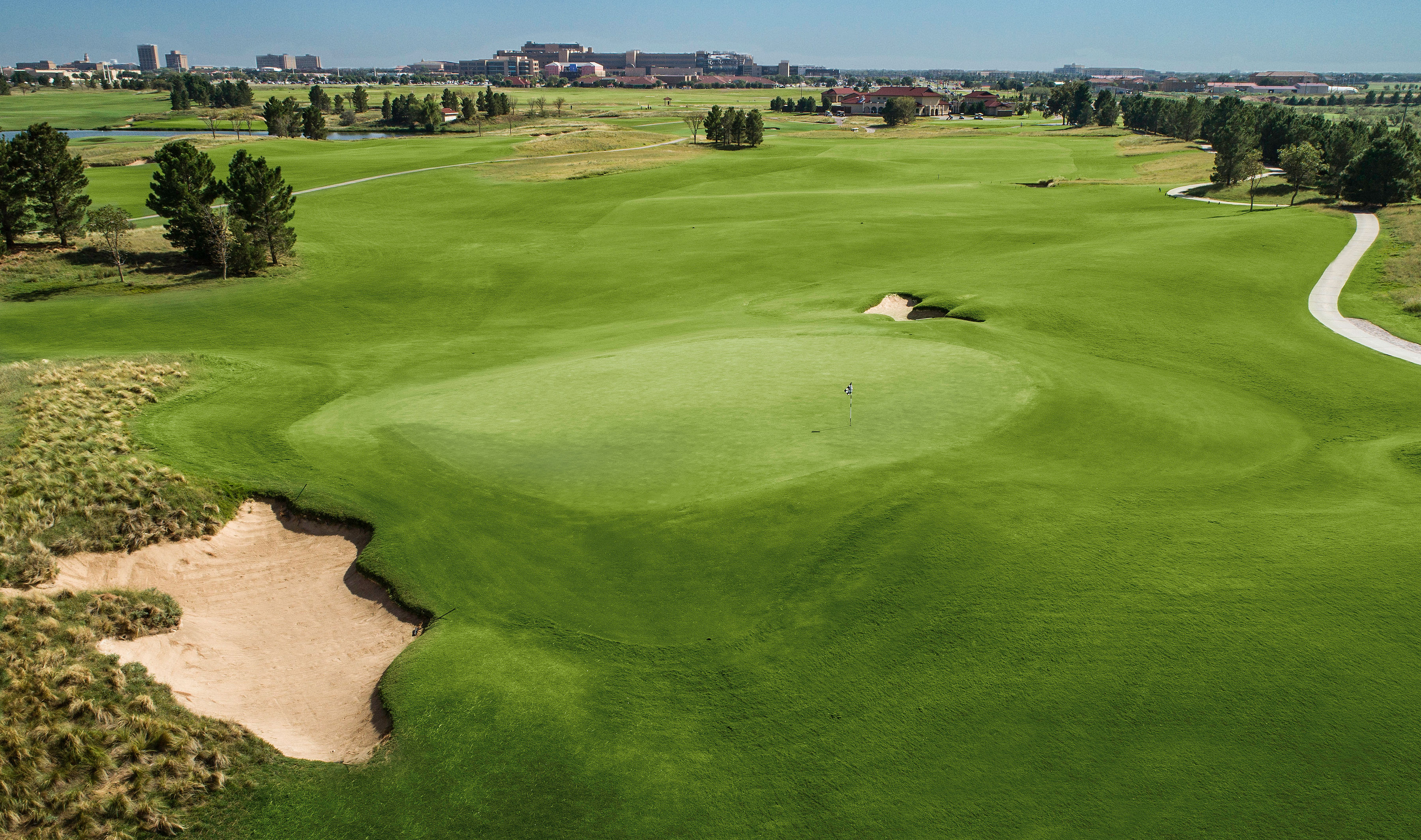 A view of hole 1 with the golf path to the right.